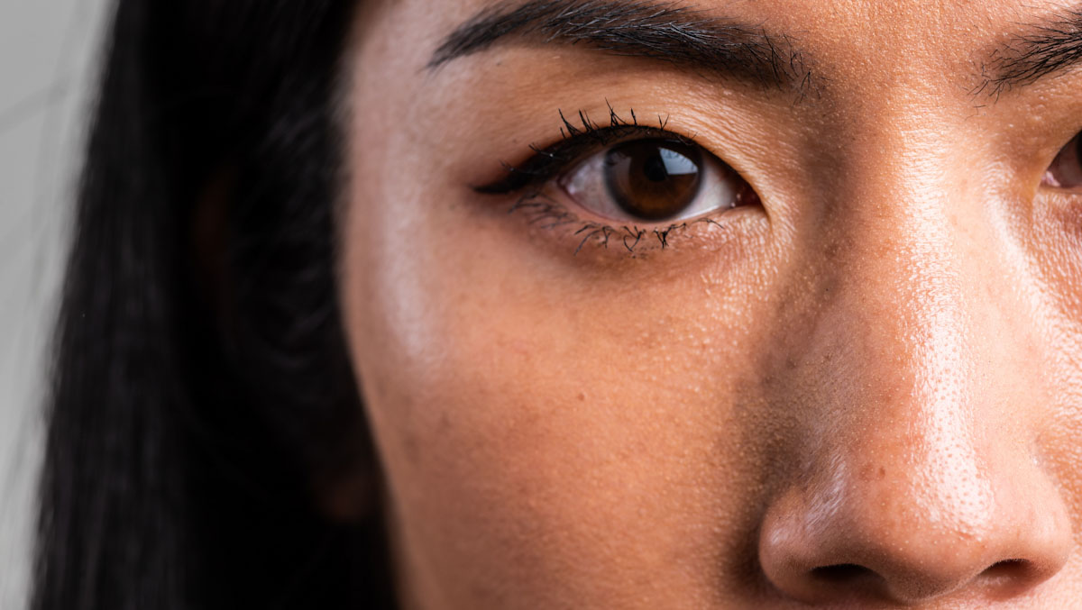 Close up of a woman's face, focusing on her eye.