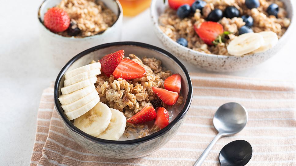 A healthy breakfast complete with fresh fruit, oatmeal and bran flakes to provide ample fiber to help ease constipation.