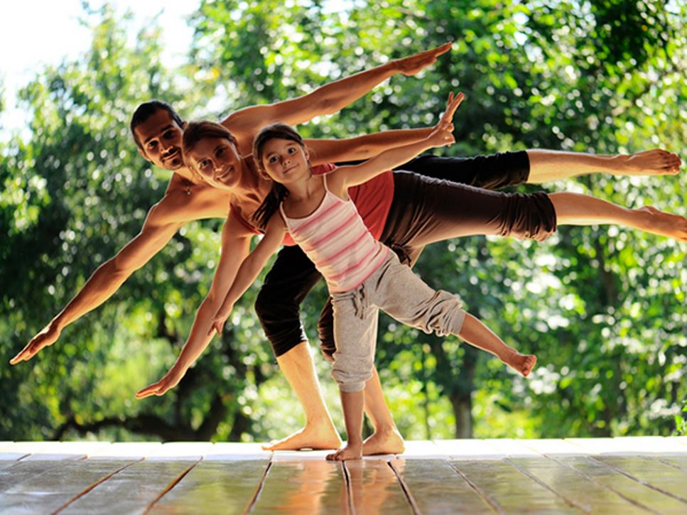 Family doing yoga together - 30-Minute Workouts for Any Schedule