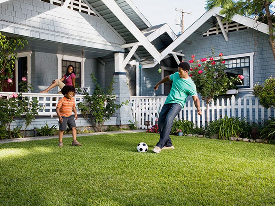 Family playing soccer