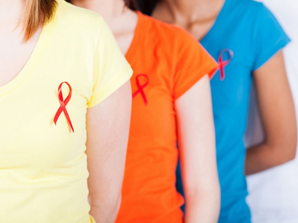 three women wearing HIV red ribbons - Nutrition Tips to Keep the Immune System Strong for People with HIV-AIDS