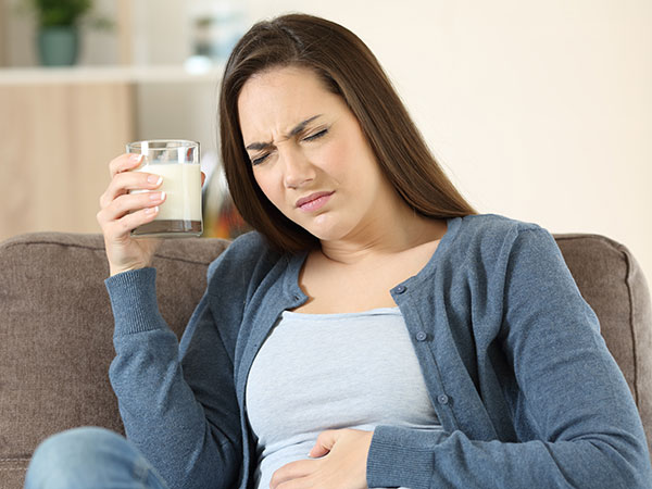 Woman upset stomach | Lactose Intolerance 