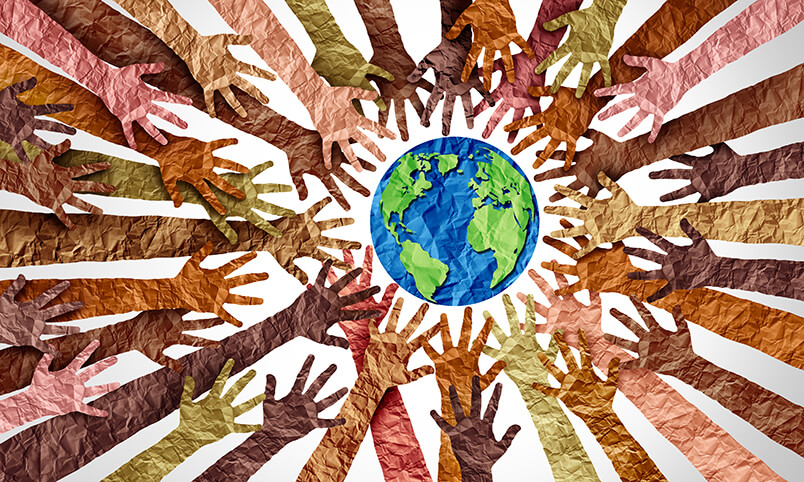 multiple cultures represented by hands reaching out toward globe