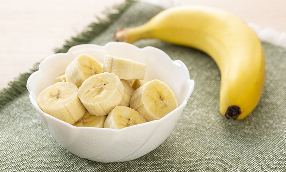Slices of bananas to be used in a recipe for Go Bananas Parfaits for a snack or dessert.