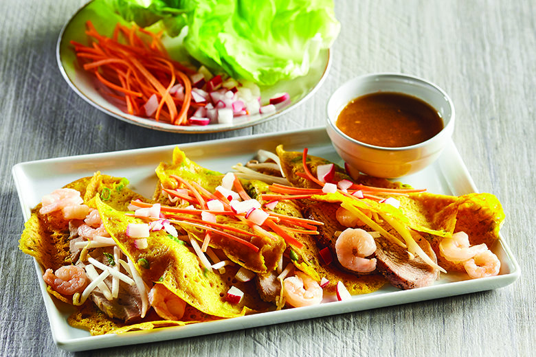 Platter of Vietnamese Shrimp Pork Crepes with dipping sauce