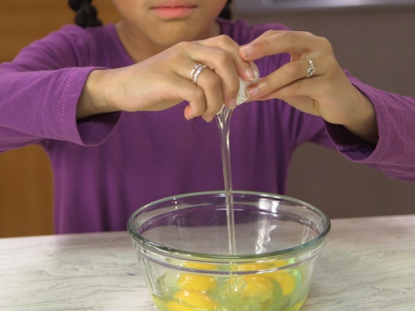 Image of Girl Cracking Eggs