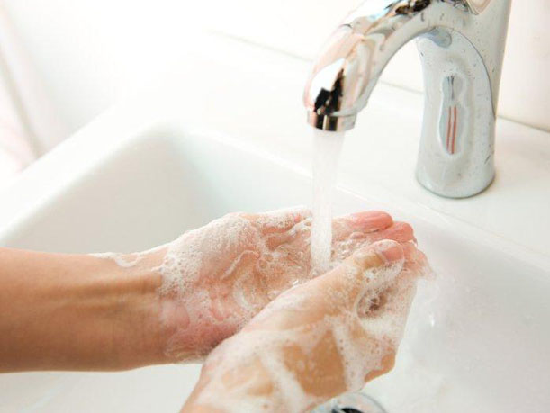 clean hands in white sink